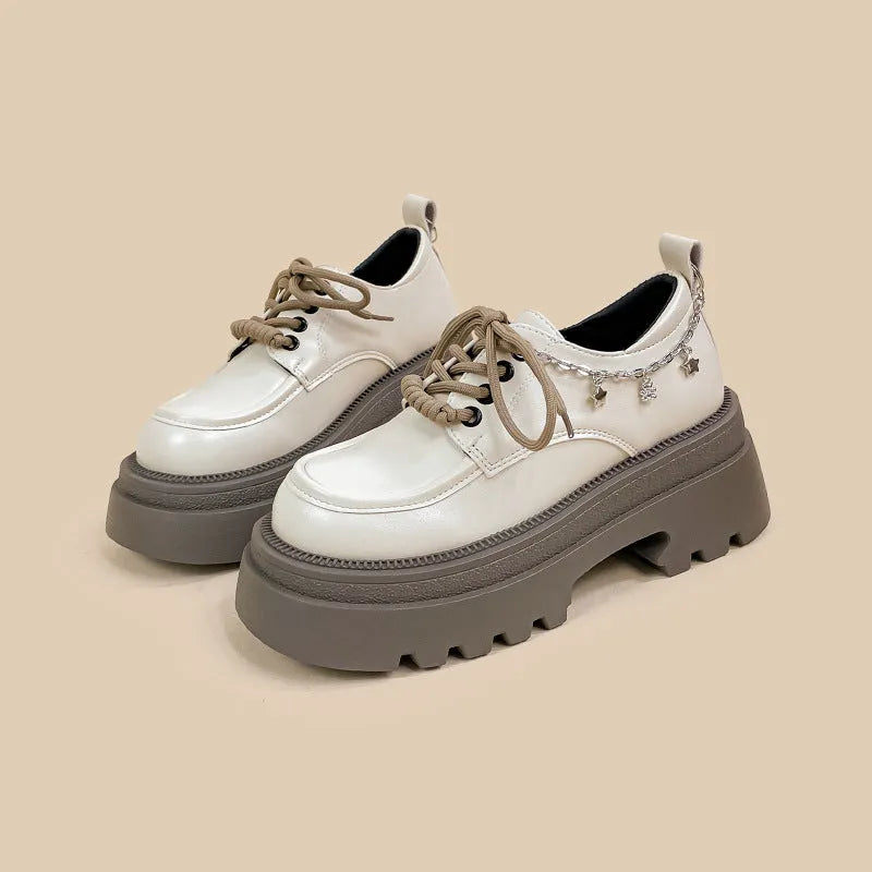 White women's Mary Jane platform shoes with chunky heel and front lace-up.
