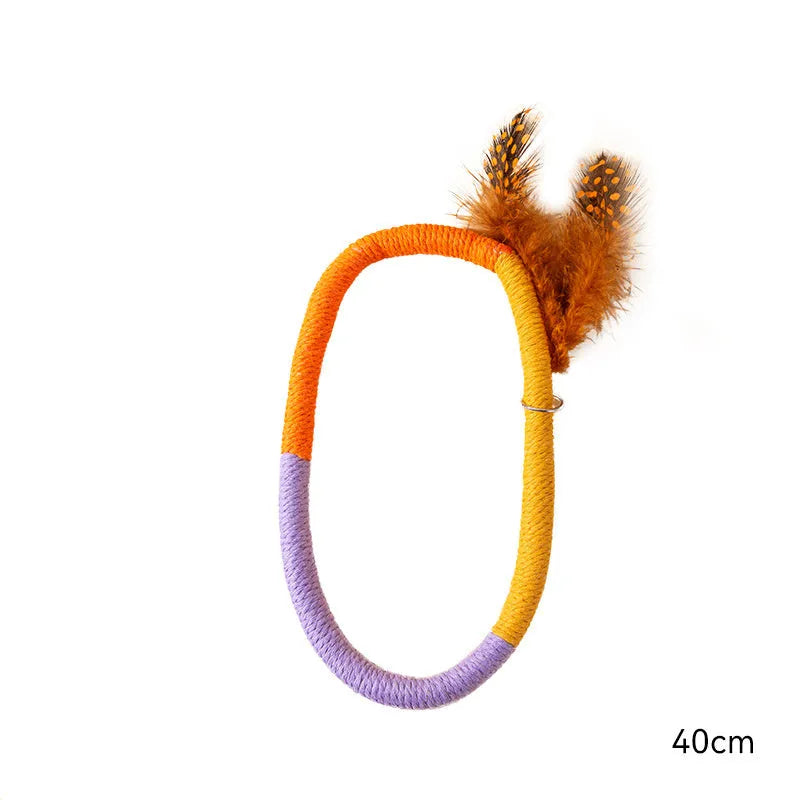 Green cotton rope circular cat toy with feather top for interactive play