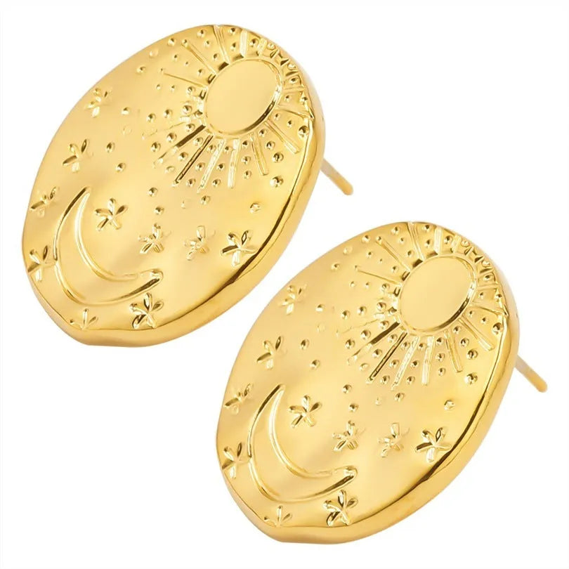 A pair of geometric-shaped stainless steel ear studs with a shell detail, shown in gold and silver colour options.