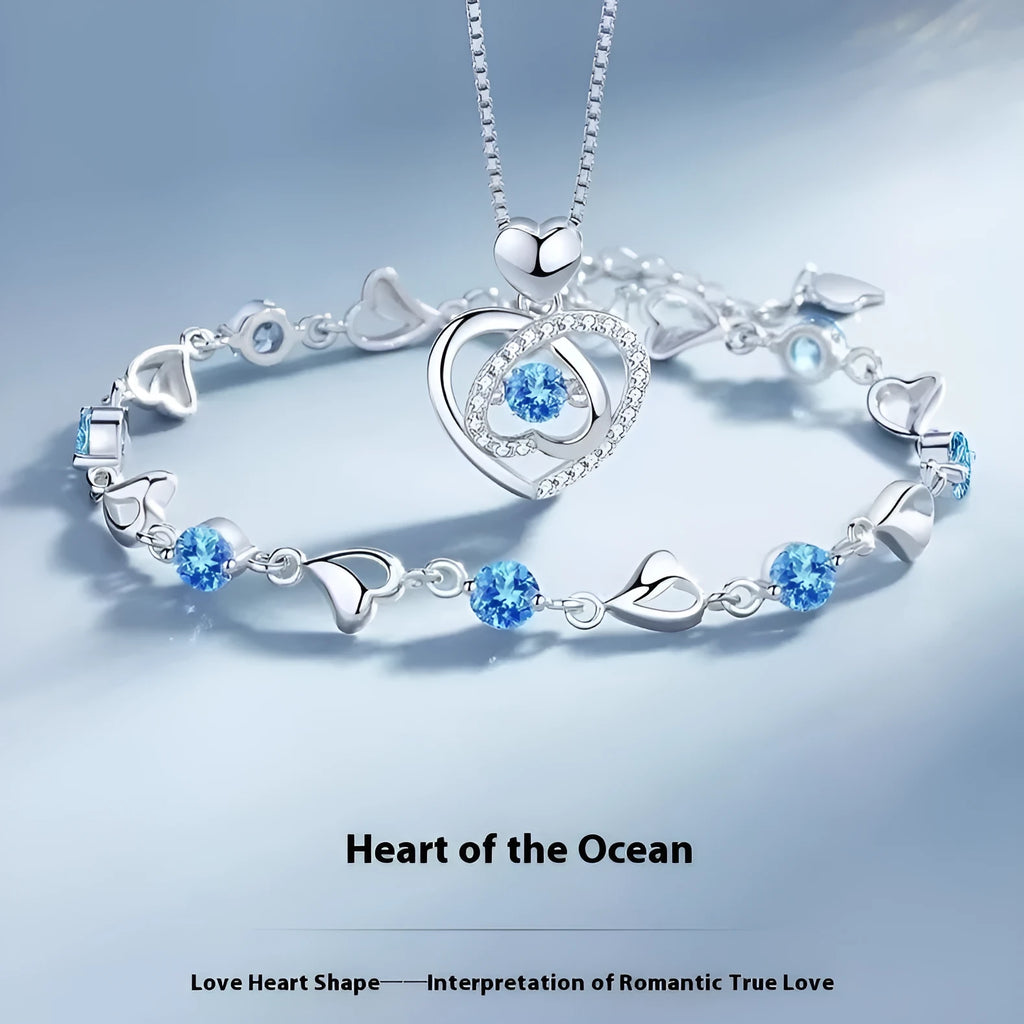 Blue diamond beating heart necklace and matching bracelet set with mixed gem inlaid pendants on geometric designs