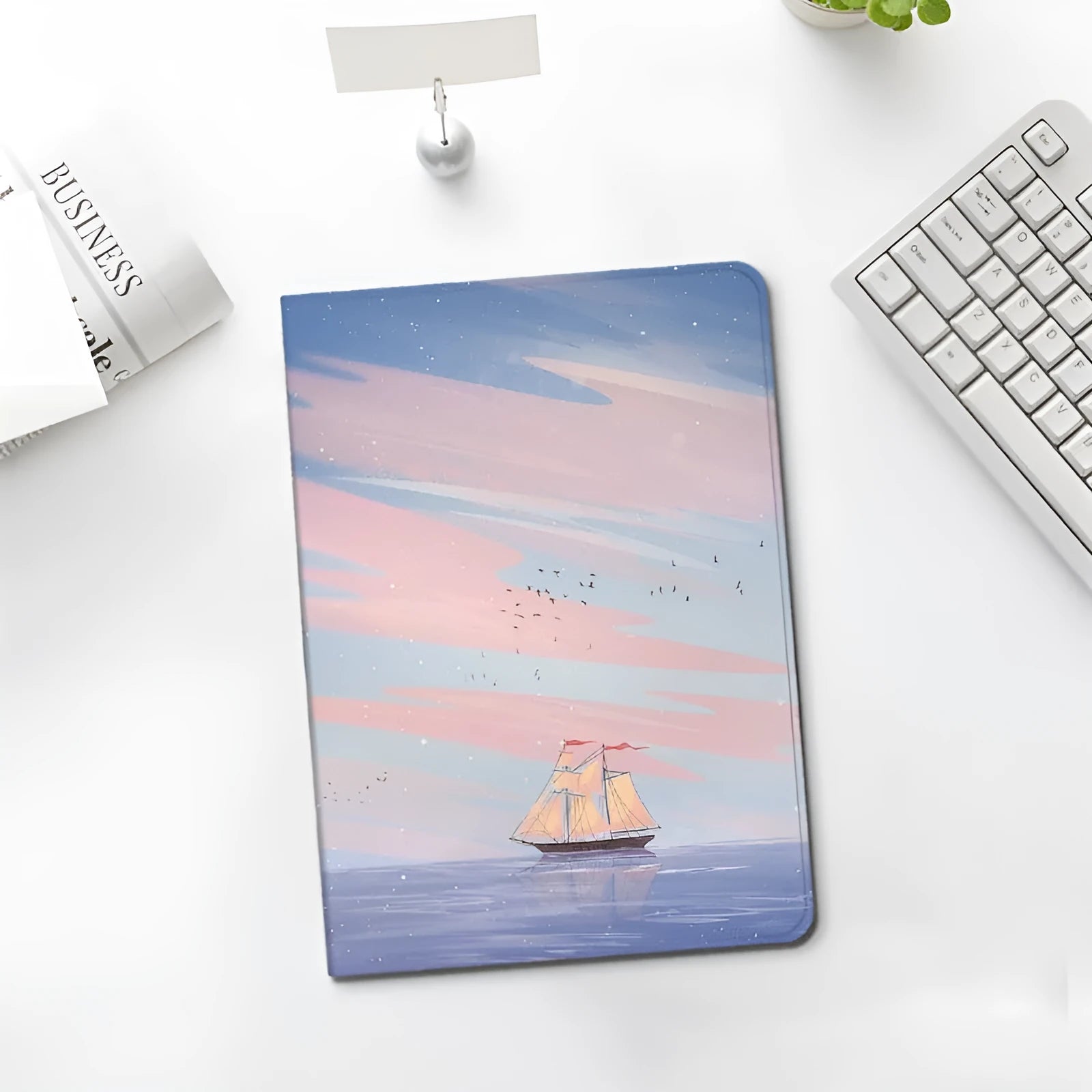 Silicone book-style iPad cover with dreamy painting style sailing motif, fits many iPad models