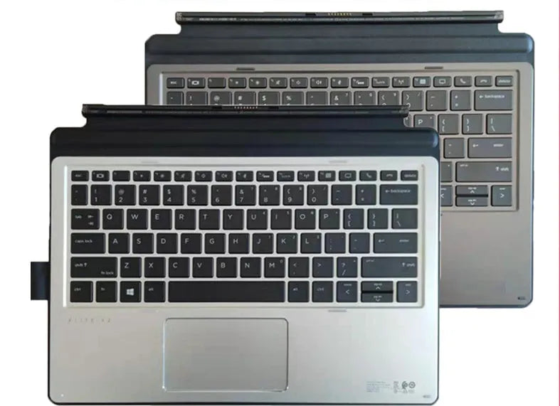 Elite X2 and Pro X2 slim tablet keyboard with PS/2 cable, wireless receiver, and multimedia keys on a wooden desk.