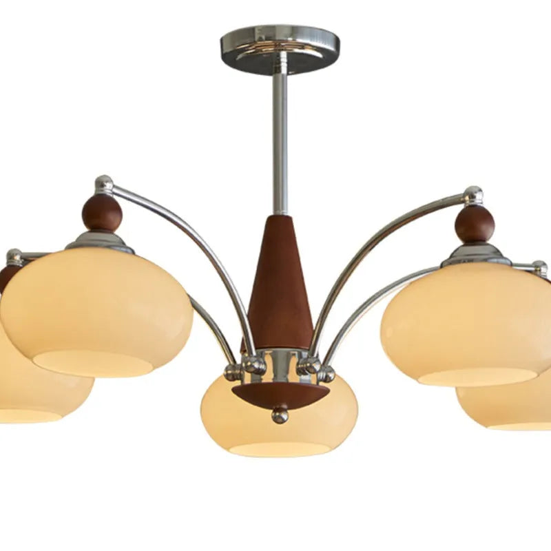 Traditional persimmon glass chandelier with multiple chrome arms and white glass lampshades hanging from a ceiling.