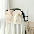 Cotton cloth hanging storage bag for baby bottles and diapers, available in six colours including bear, olive, and tulip
