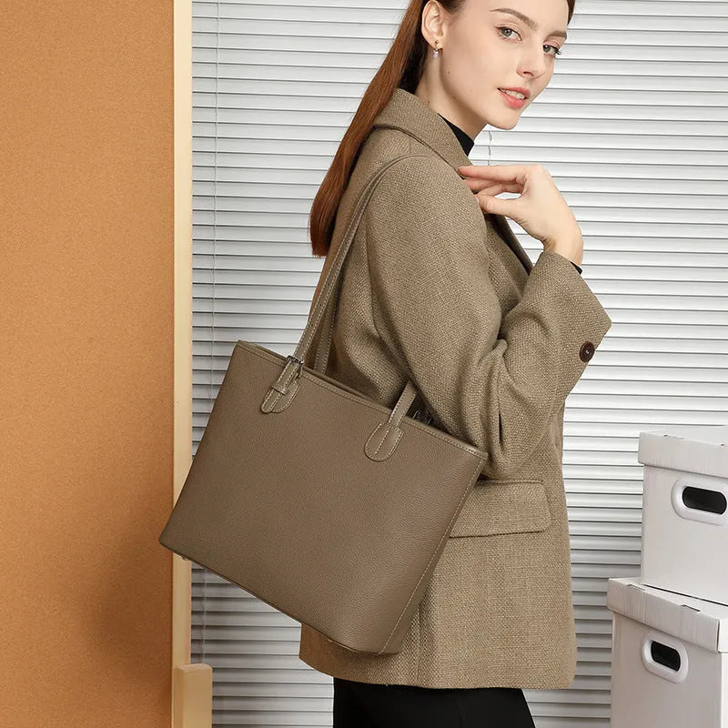 Genuine leather women's tote bag in retro style showing multiple compartments and horizontal suitcase shape