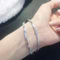 Women's silver-plated copper closed double ring bracelet in a geometric shape, smooth surface, available in 56mm to 62mm sizes