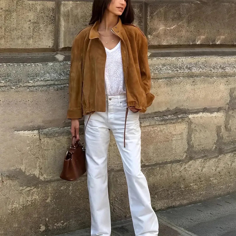 Retro solid colour loose-fit polyester jacket with long sleeves on a hanger.