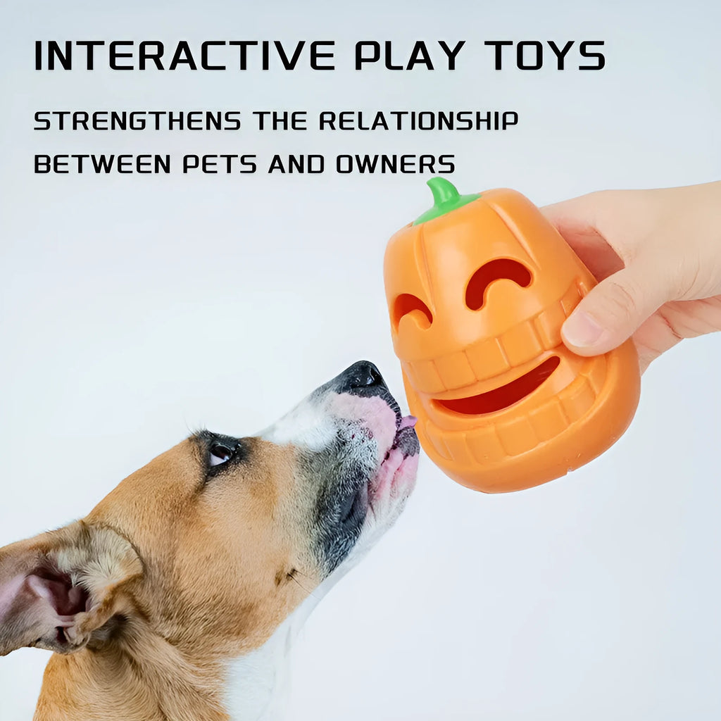 Orange Halloween pumpkin-shaped dog chew toy with a treat-dispensing funnel hole.
