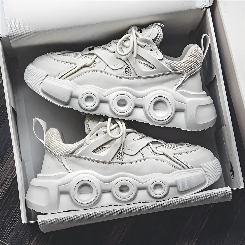 Men's low-top sneaker in grey with breathable mesh upper, thick rubber sole, round toe, and lace-up front.