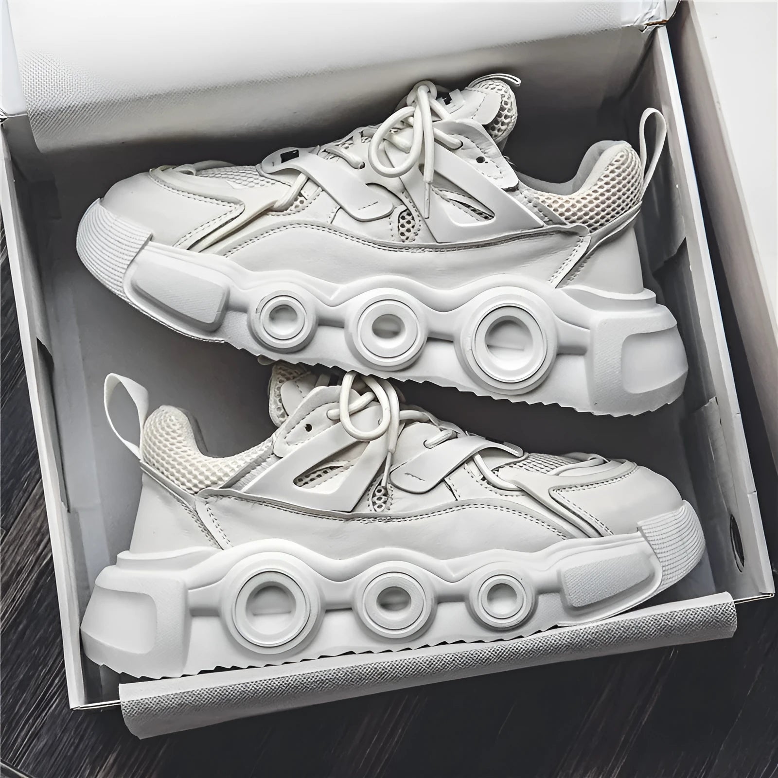 Men's low-top sneaker in grey with breathable mesh upper, thick rubber sole, round toe, and lace-up front.