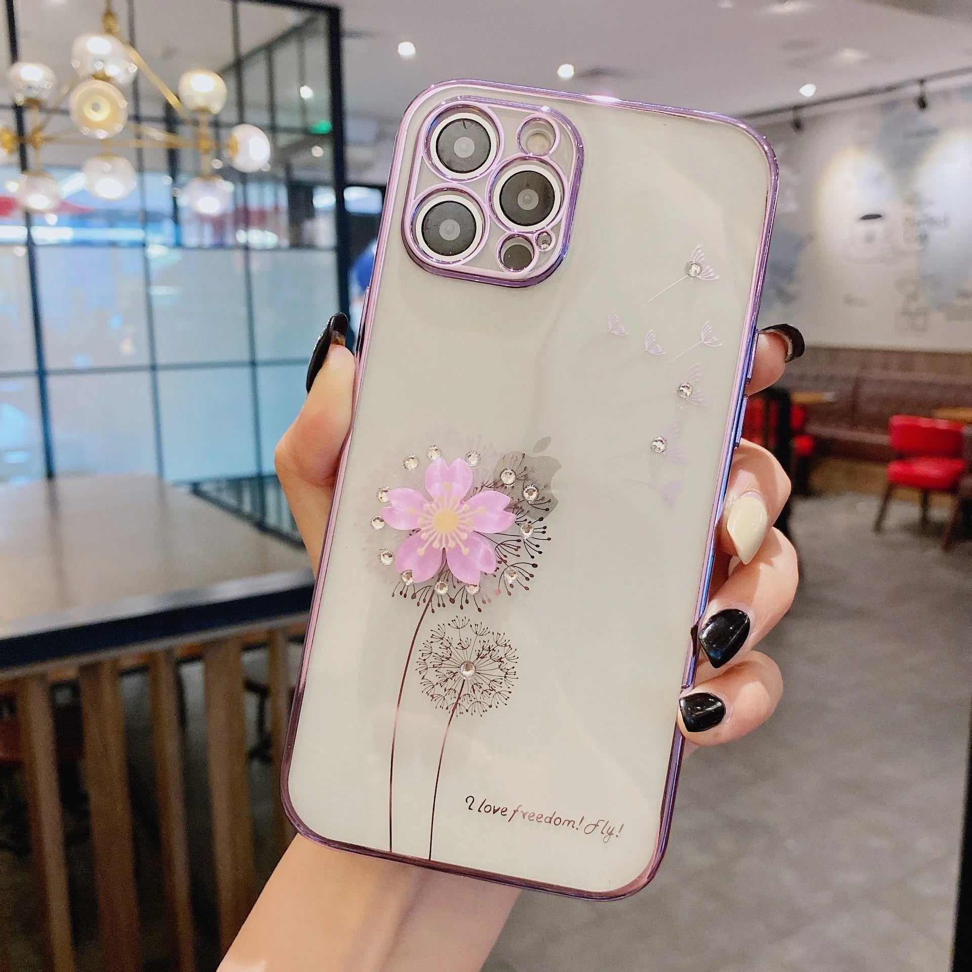 Green iPhone case with 3D floral design and a rotating kickstand extended from the back.