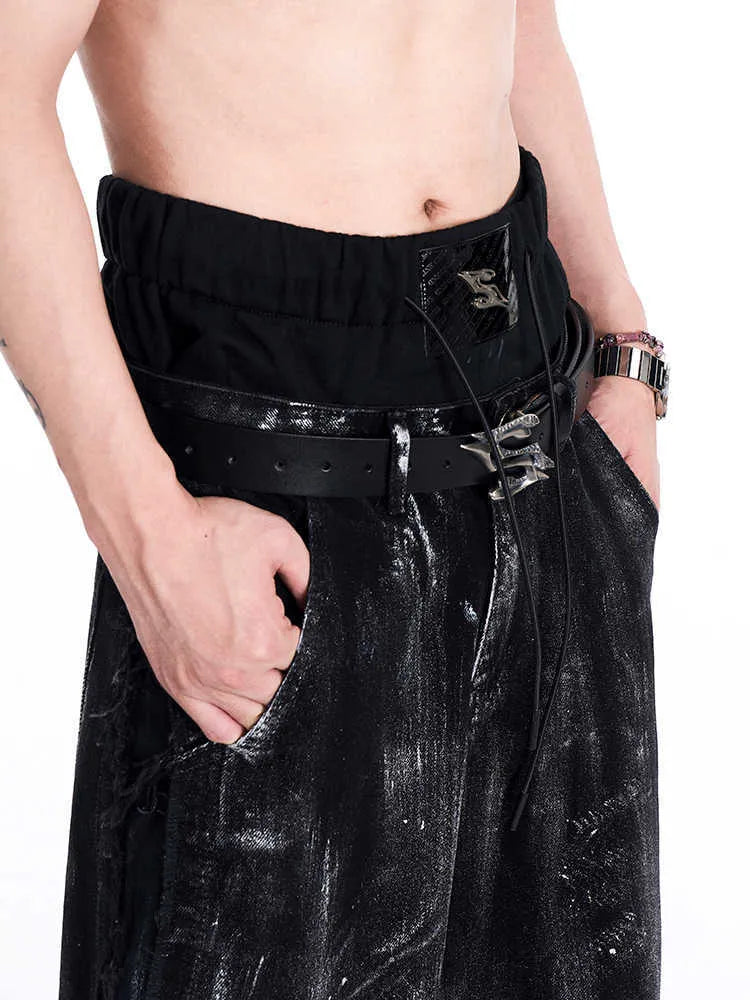 Black men's leather belt with a metal letter buckle, showing the two-layer cowhide construction.