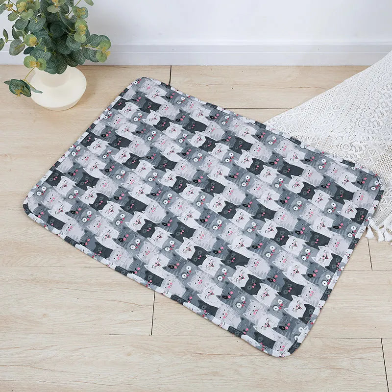 Reusable waterproof pet training pad showing animal print design options and size variations