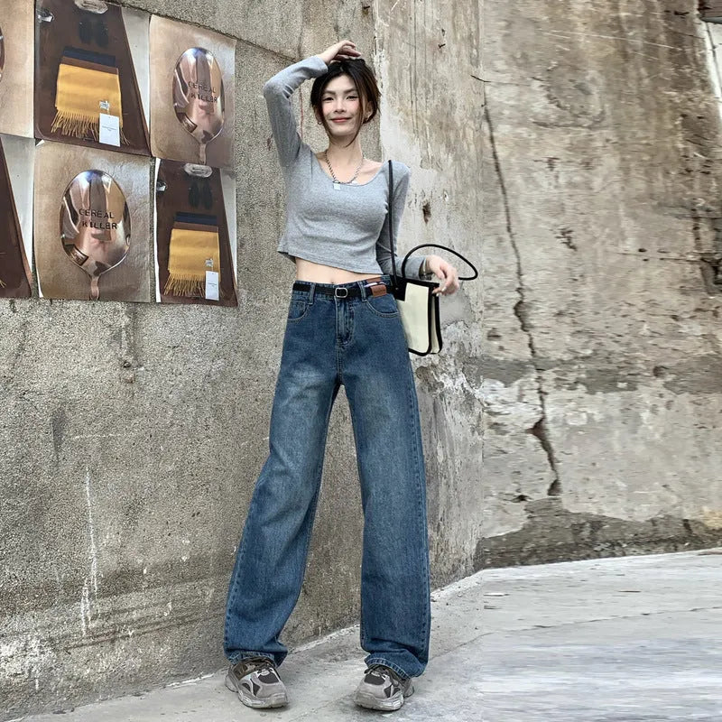Women's high-waisted retro blue straight-leg jeans in 100% cotton denim laid flat.