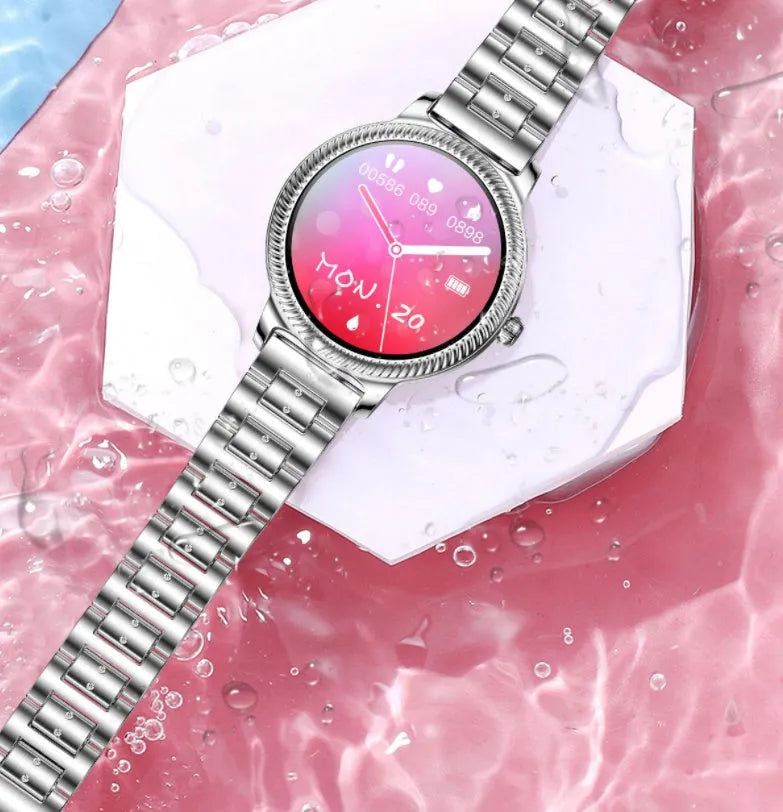 AK38 ladies smartwatch with stainless steel band on a wrist, showing its colour screen display.