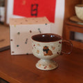 Antique caramel ceramic goblet with saucer featuring a beaming cat cartoon pattern in Autumn Squirrel colour, 250ml capacity