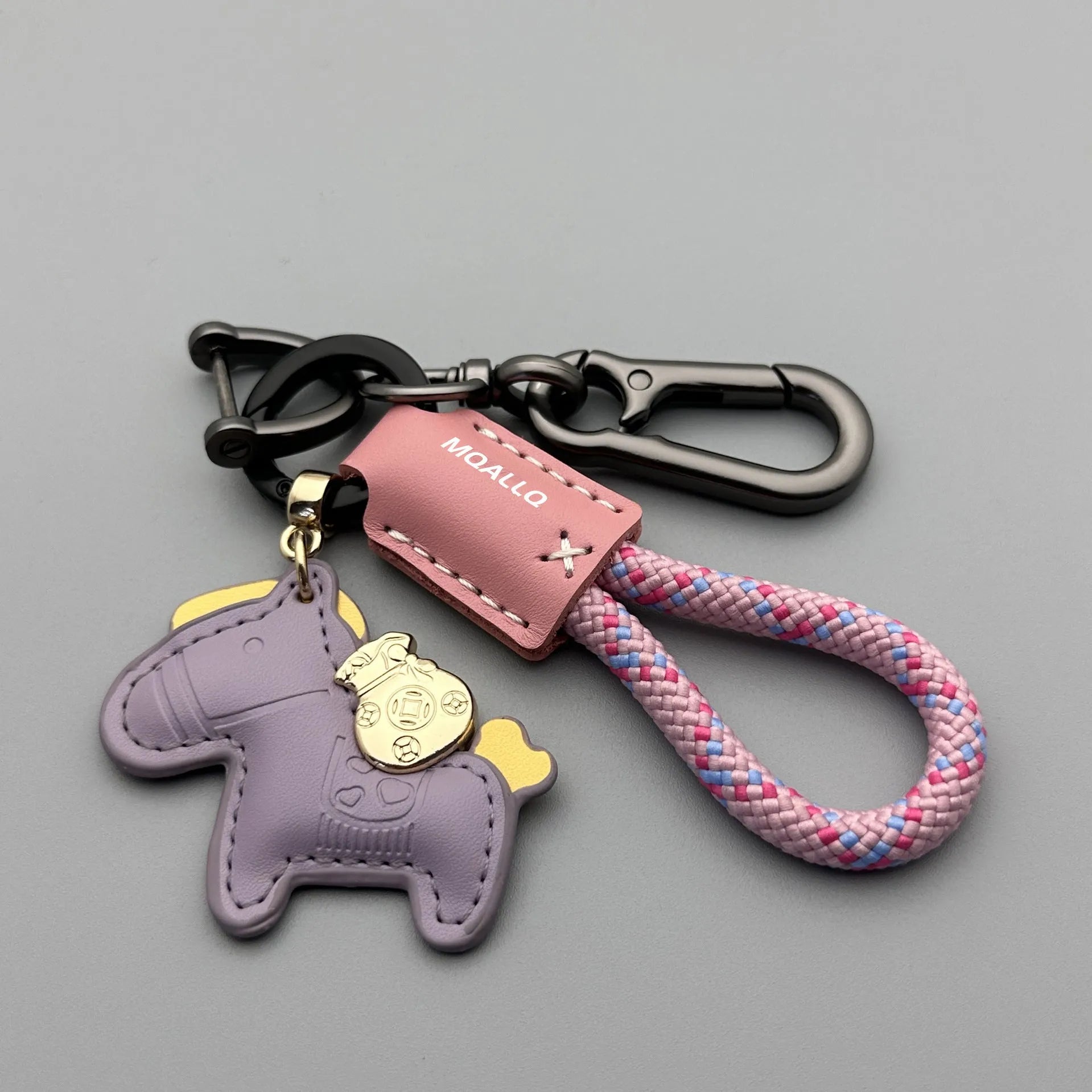 Handmade brown cowhide leather keychain with a silver pony belt buckle charm and green velvet rope.