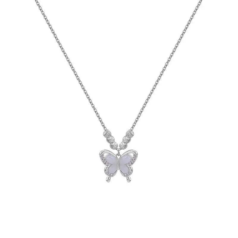 Women's 925 sterling silver butterfly necklace with square line opal detail on an adjustable cross chain.