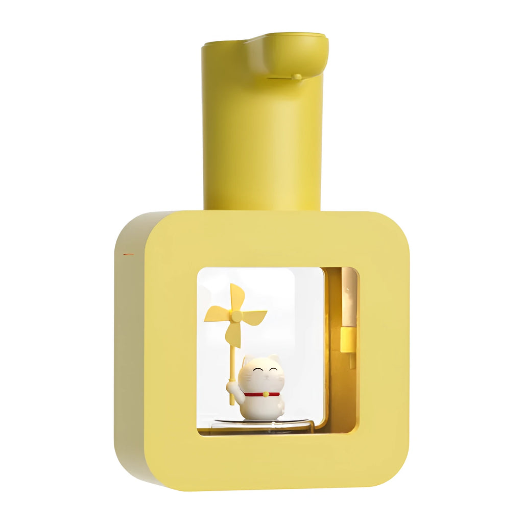 Yellow automatic soap dispenser for kids with unicorn cartoon design on a bathroom counter.