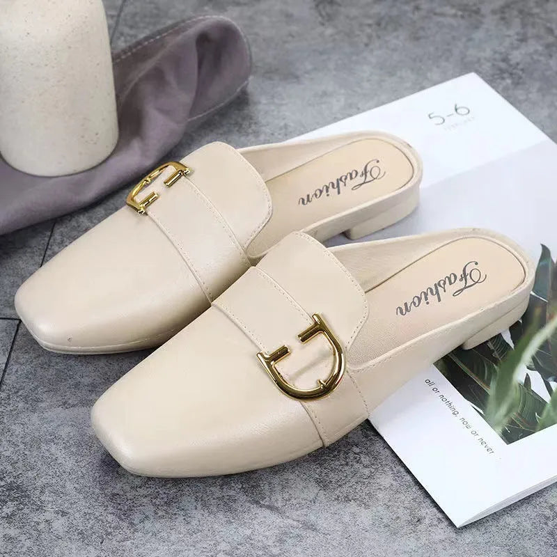 Women's closed toe PVC half slipper in milky white with a double buckle fastening.