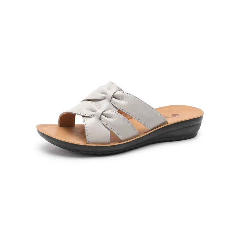 Solid colour cowhide slippers for women with soft non-slip soles in beige, black, and red options