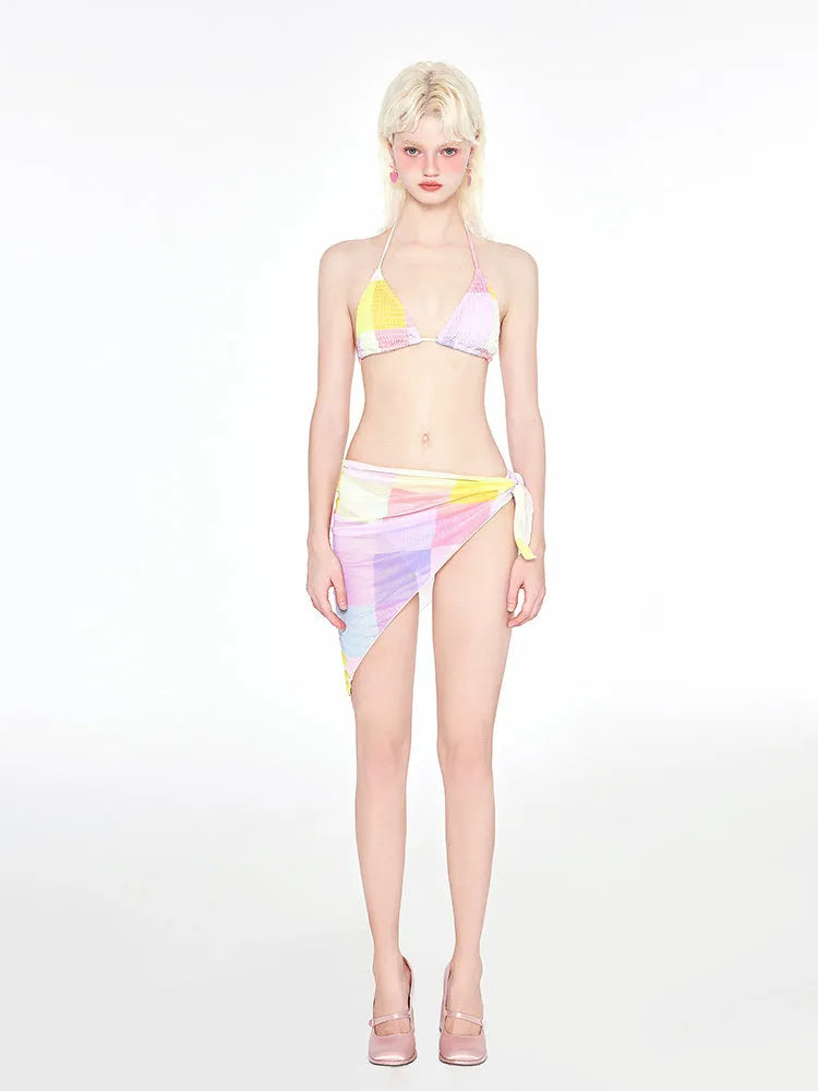 Rainbow pink triangle bikini three-piece swimsuit set on a hanger.