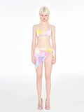 Rainbow pink triangle bikini three-piece swimsuit set on a hanger.