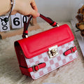 A retro-style apricot PU crossbody bag with a square shape, decorative stitching, and a visible file compartment inside.
