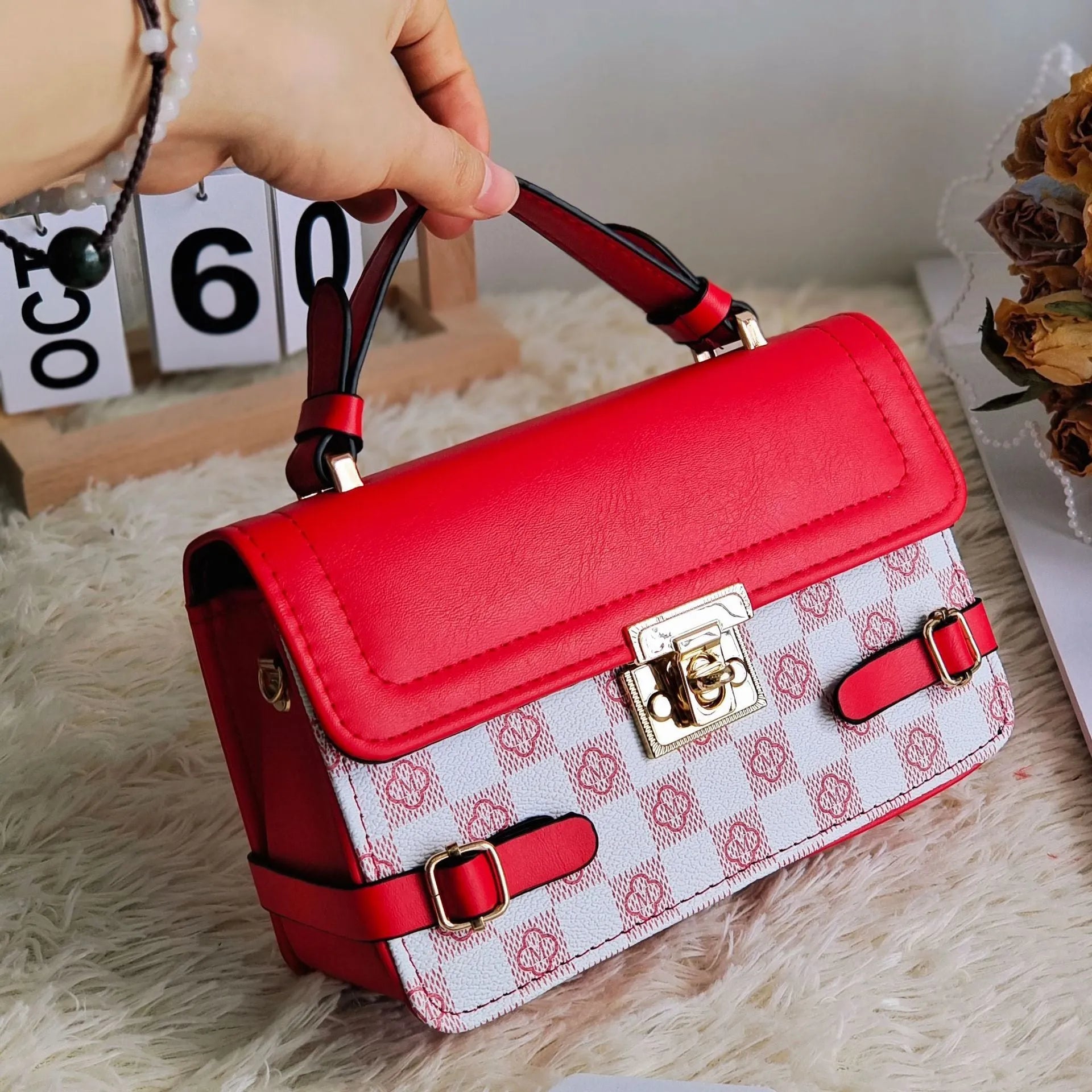 A retro-style apricot PU crossbody bag with a square shape, decorative stitching, and a visible file compartment inside.