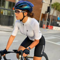 Attaquer women's cycling jersey and bib shorts set from the Kaleidoscope collection on a model