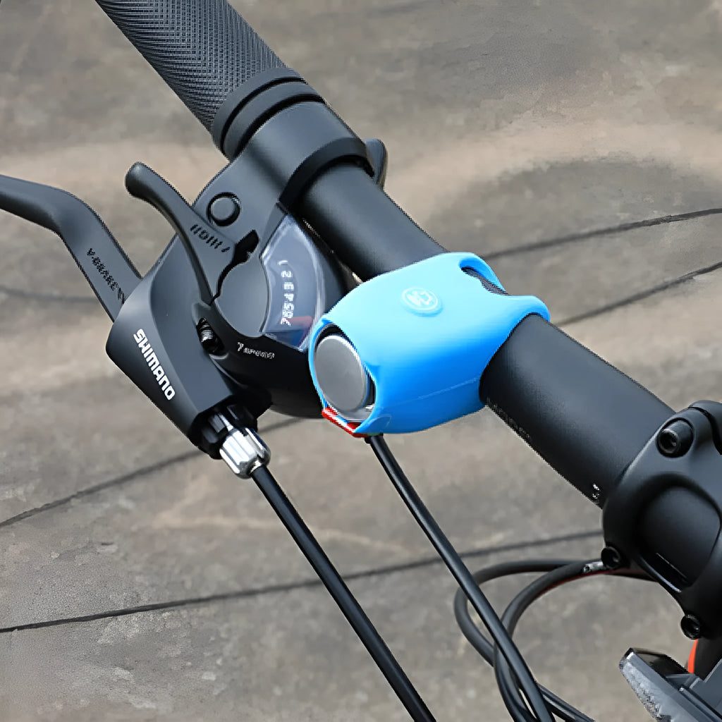 Plastic electronic bicycle horn in six colour choices showing compact size for handlebar mounting.