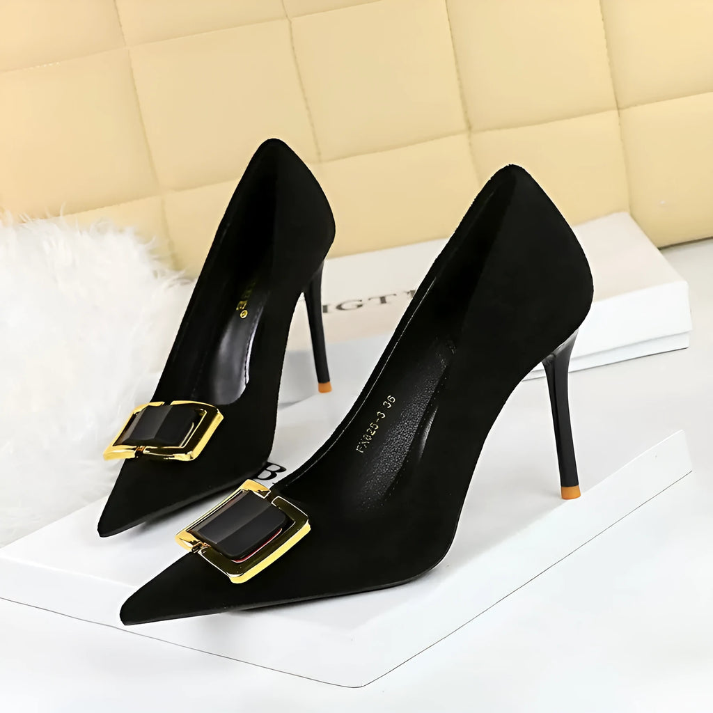Black suede women's stiletto high heels with a pointed toe and a 9cm heel on a rubber sole.