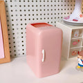 Creative refrigerator-shaped plastic pencil case in white, light blue, and pink colour options on a desk