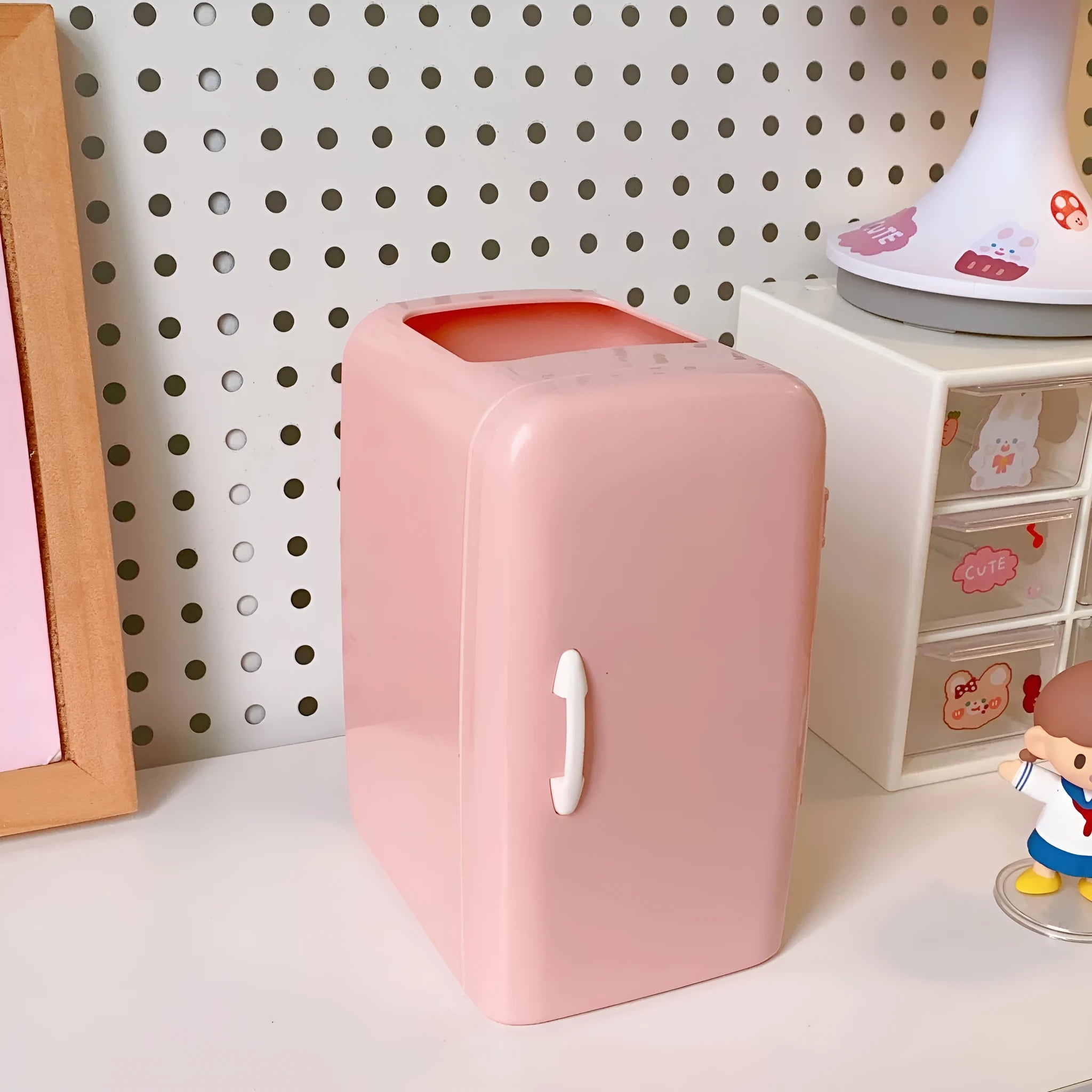 Creative refrigerator-shaped plastic pencil case in white, light blue, and pink colour options on a desk