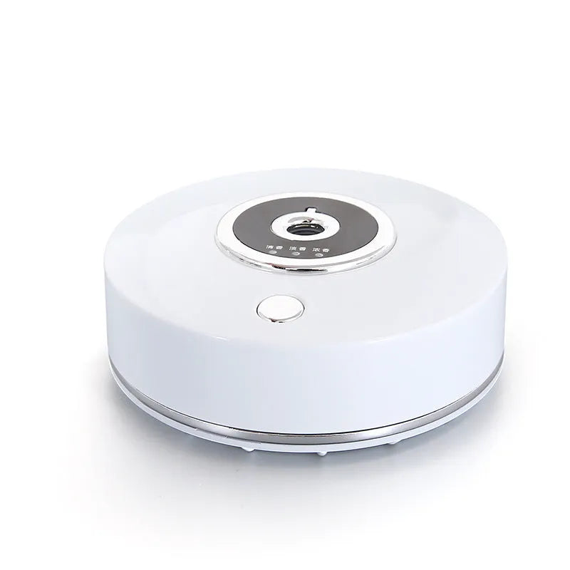 USB-powered car air freshener spray unit in black, grey or white with charging cable and anti-slip pad