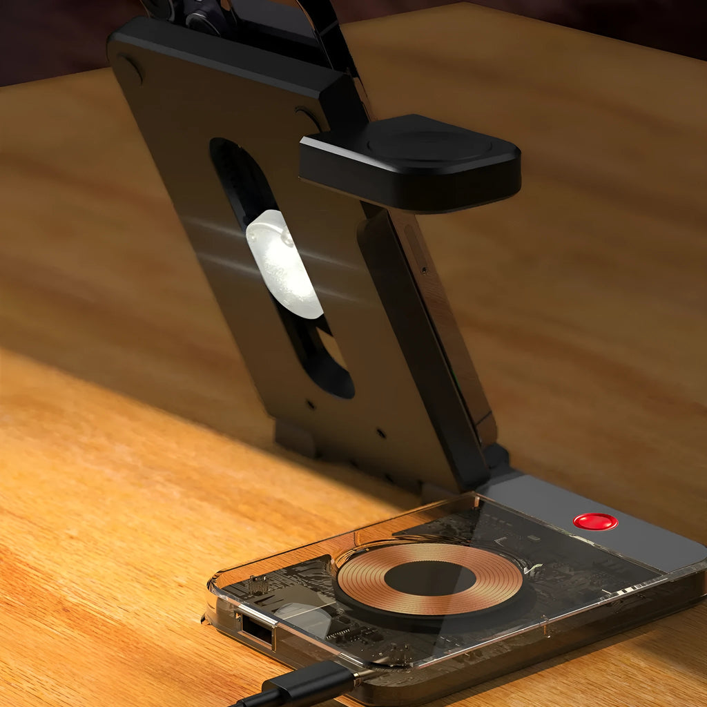 Black and white foldable three-in-one wireless charging stand for phone, watch, and earbuds on a desktop