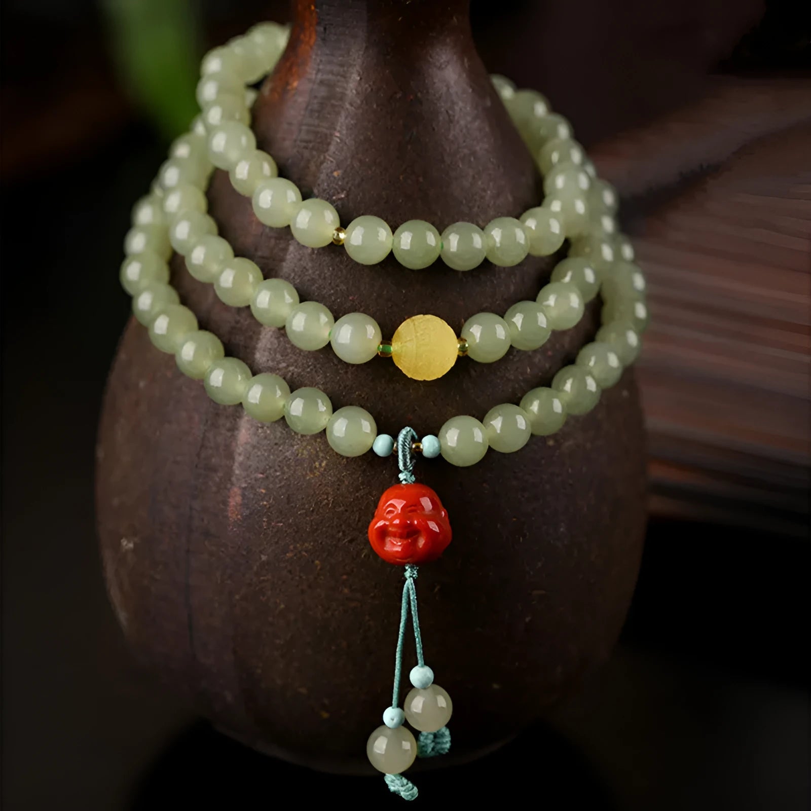 Pale blue Hetian jade bracelet with three circles of 6mm beads on a wrist.