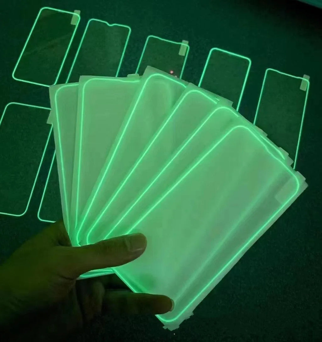 Glow-in-the-dark pink tempered glass screen protector fitted on an iPhone 13 Pro Max showing full-screen coverage.