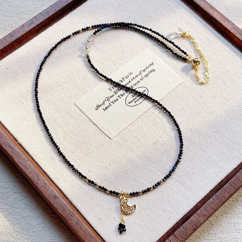Women's three-ring layered bracelet with blue san stones in gold-toned settings, showing adjustable clasp