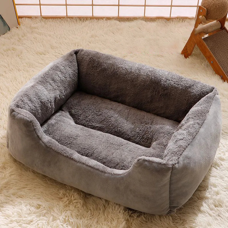 Short plush rectangular pet bed for cats and dogs with a removable cover in grey, shown in a large size.