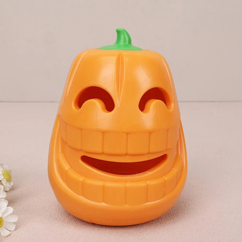 Yellow pumpkin-shaped dog chew toy made from TPR material measuring 8.6x11.5cm