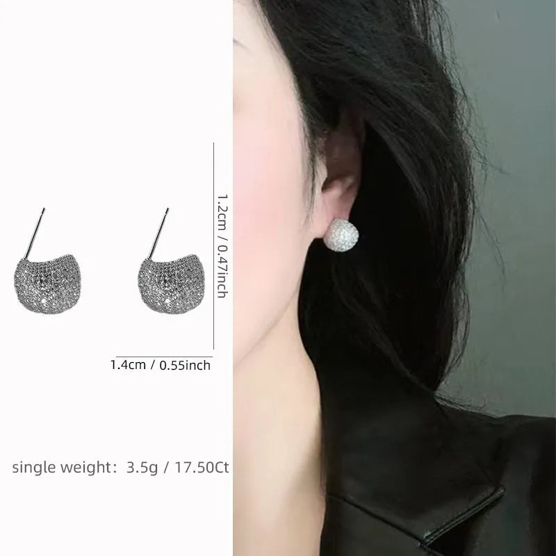 Golden bean earrings with diamond-cut detailing and ear clip fastening in drop shape