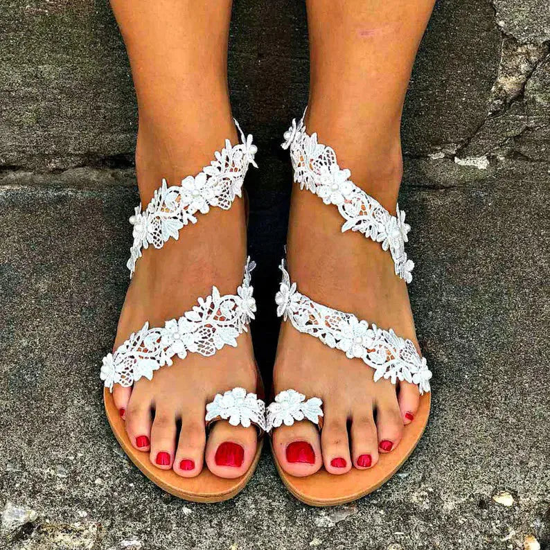 White women's sandals with rhinestone flower decoration and elastic back in sizes 35-43