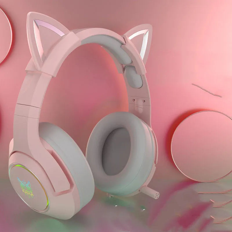 Pink cat ear wired headphones with microphone and LED lights on a stand