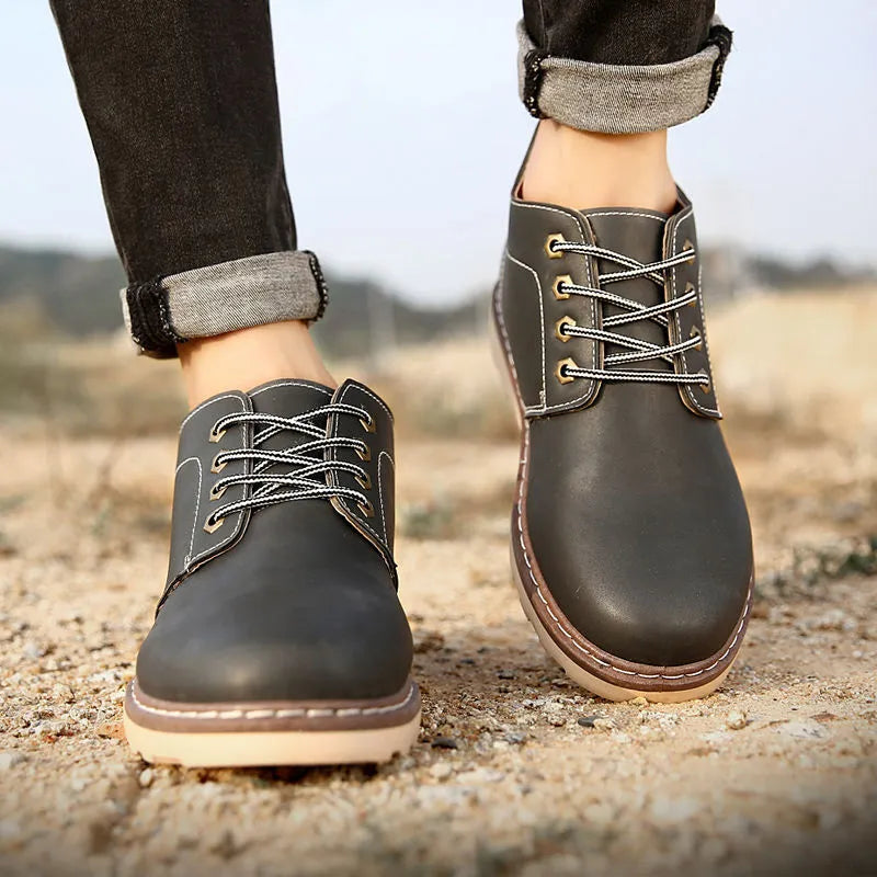 Men's black mid-top Tide British style waterproof boots with a flat rubber sole.
