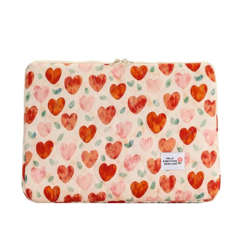 Women's printed floral cloth laptop bag shown in green flower pattern, available in small, medium, and large sizes.