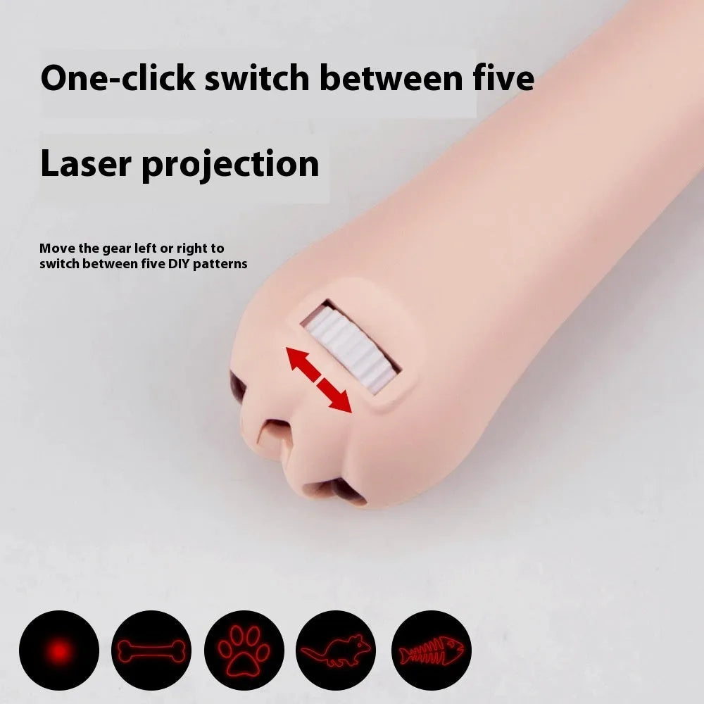 Small white infrared laser cat teasing stick with LED light, shown on a table with a USB charging cable.