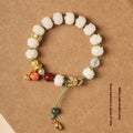 White jade Bodhi bracelet with lotus and pumpkin beads on open rope design