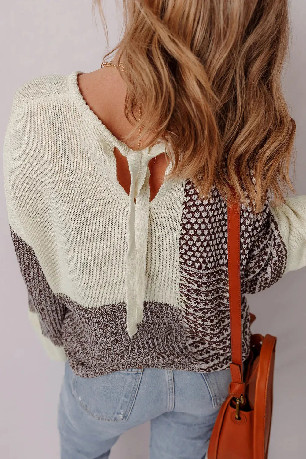 Dark khaki colour block loose sweater with dropped shoulders and a back tie fastening.
