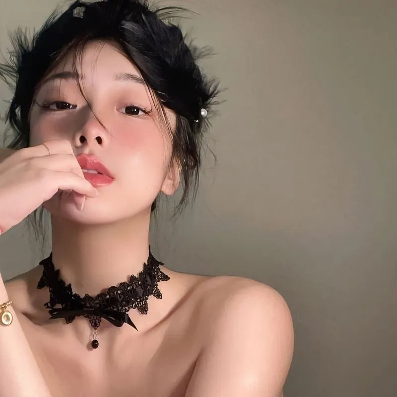 Lolita gothic bow lace choker necklace with fabric pendant and alloy chain on display